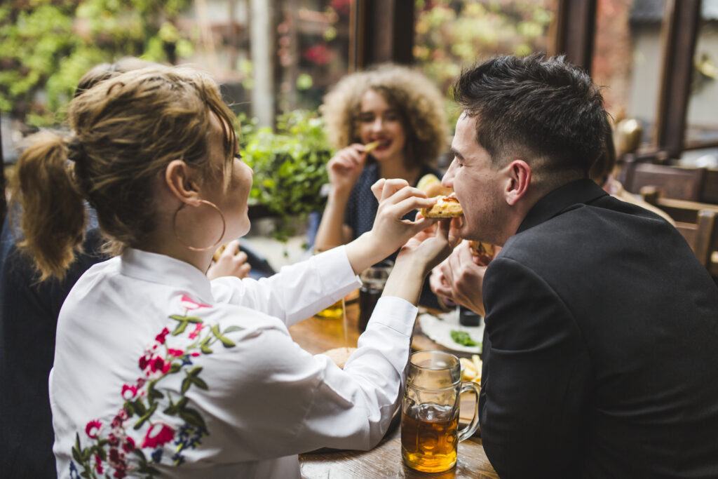friends-eating-conversating-restaurant